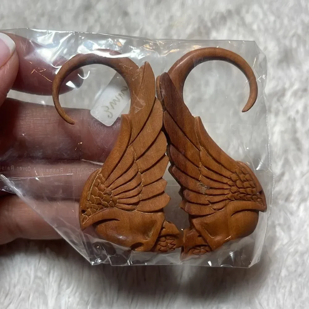 Hanging skull and wings wood carved gauges hanging